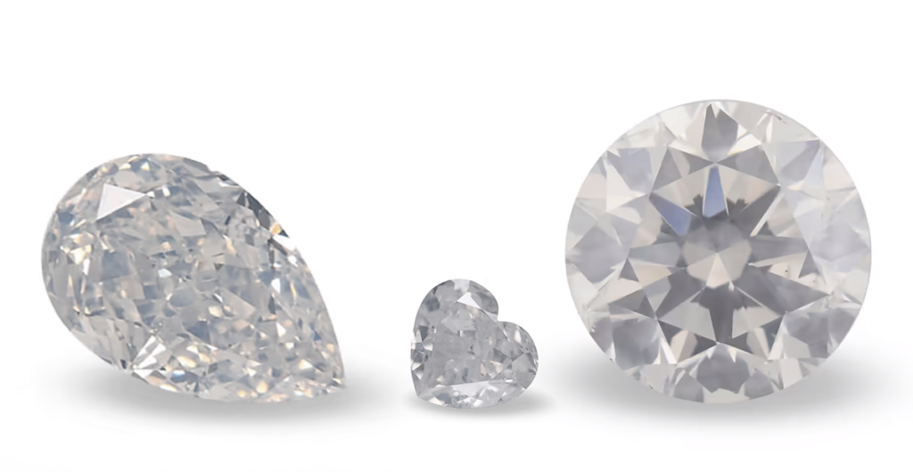Diamenty Fancy White w różnych kształtach szlifu.